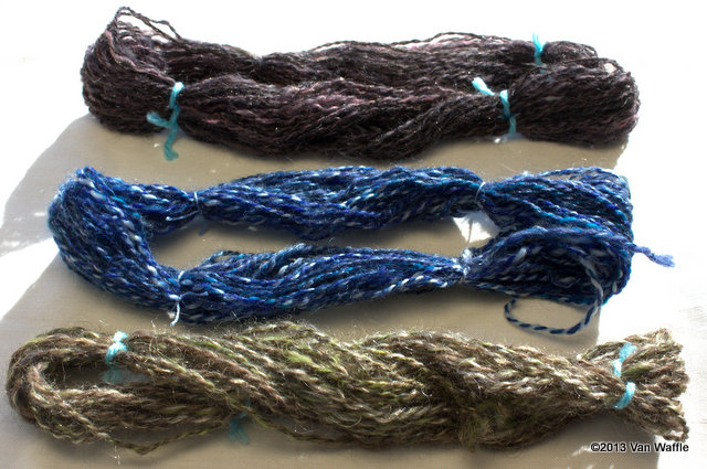 Three yarns samples spun from roving made with a hackle